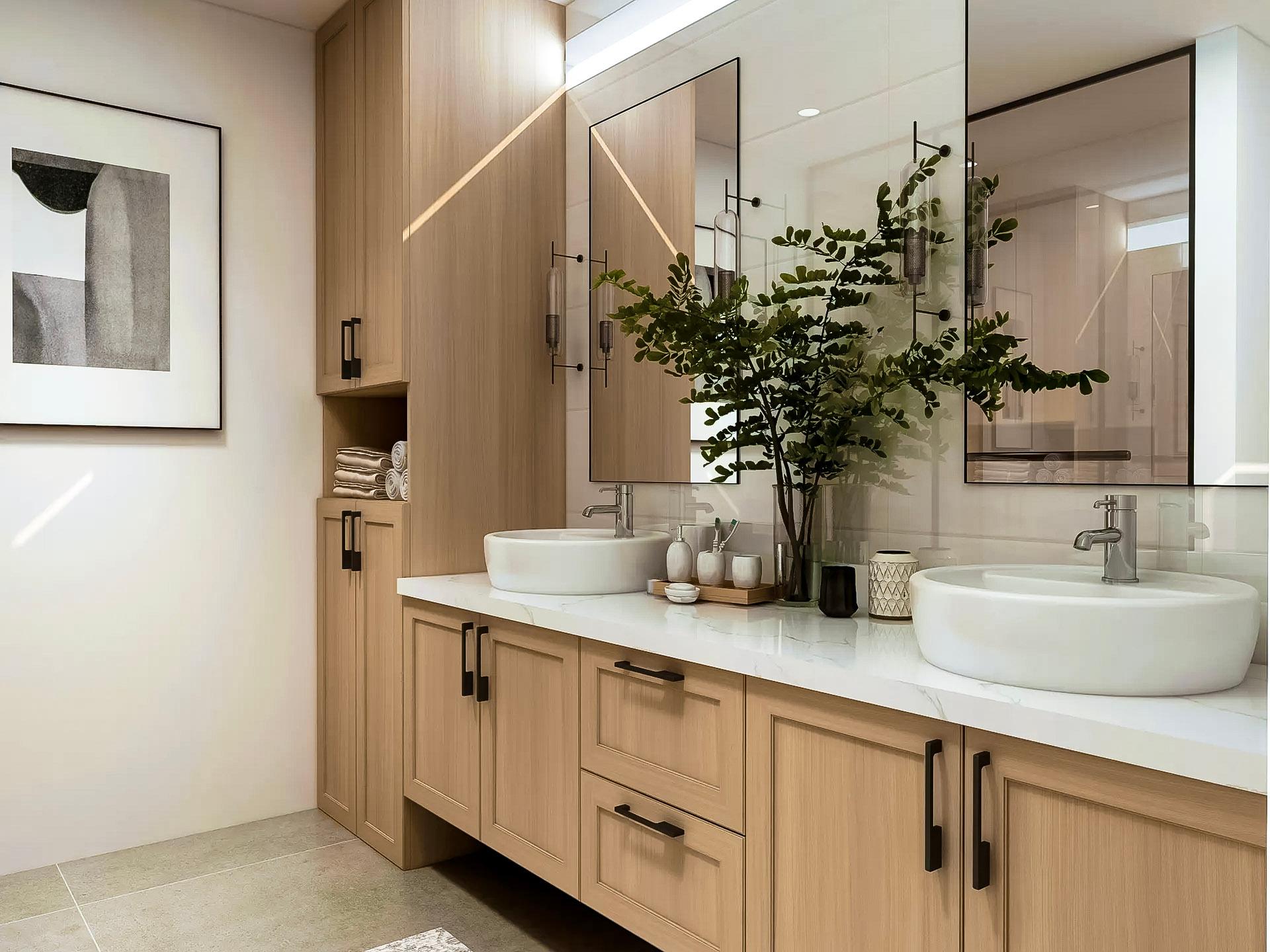 Salle de bain moderne avec meuble-lavabo en bois, double vasque blanche et comptoir en marbre. Miroirs avec éclairage intégré, rangements spacieux et décoration végétale élégante.